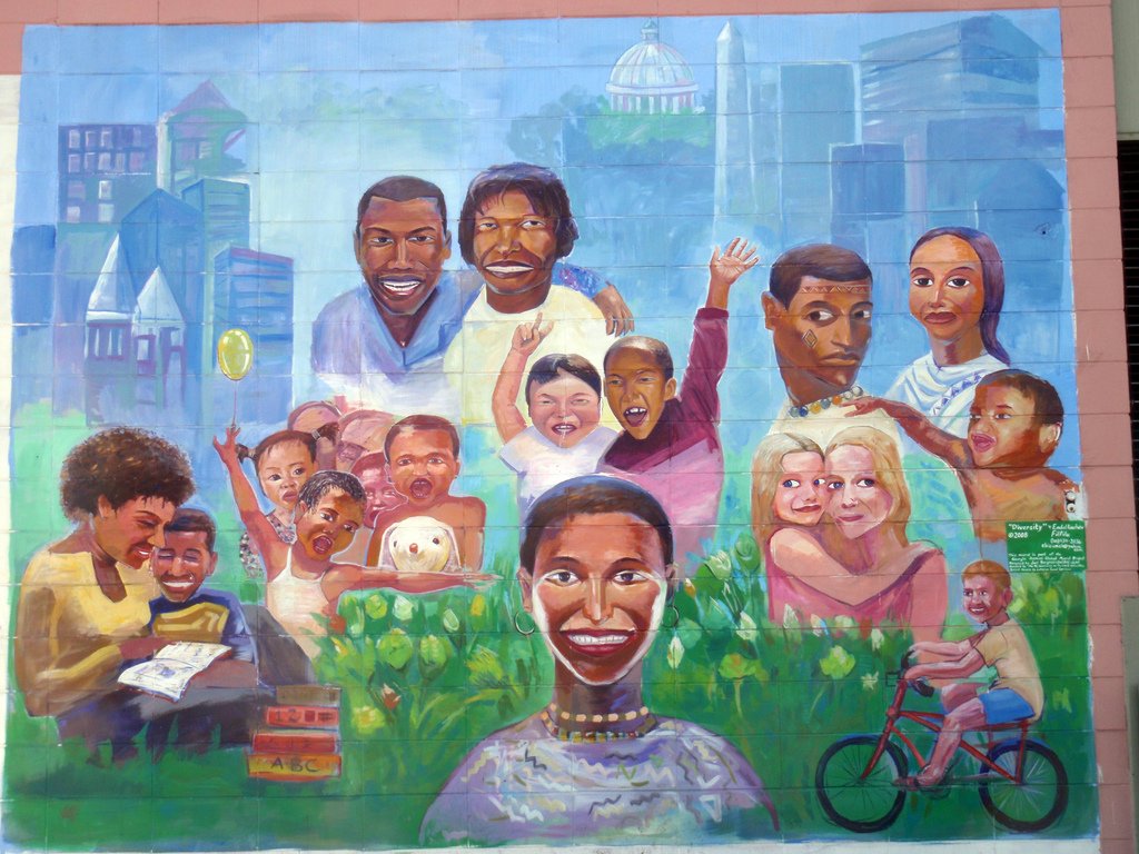 Diversity Mural, artist: Daquella Manera.  This mural depicts an err of diversity, depicting individuals of a diverse set of cultural backgrounds.  Credit: https://www.flickr.com/photos/53875590@N07/5077310370